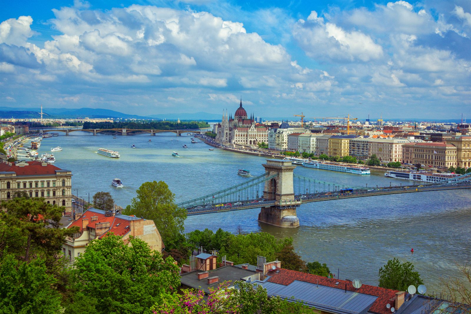 View over Budapest and the Chain Bridge with river cruise ships on the Danube